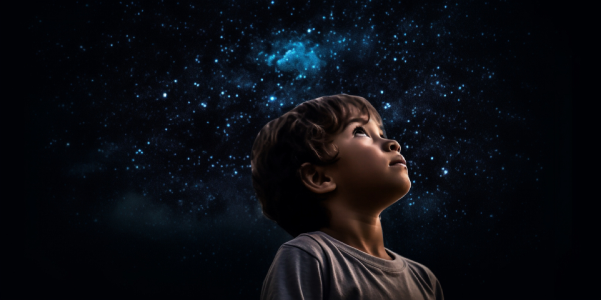 Child gazing up at stars in wonder